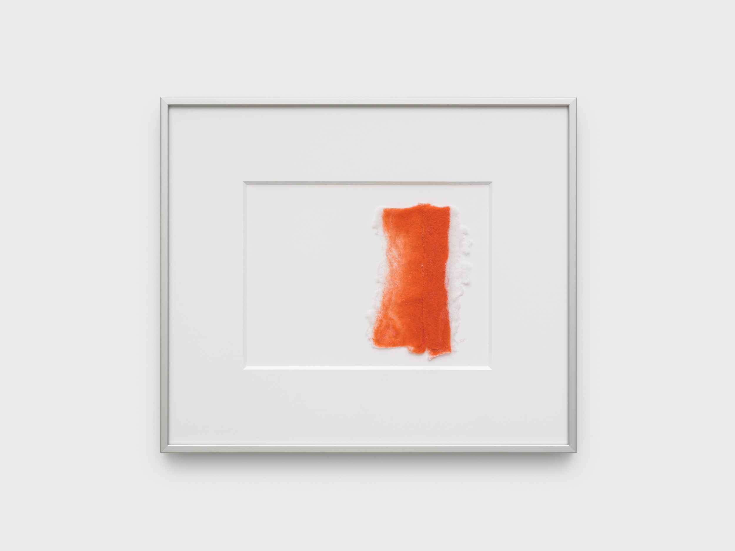 Aisha Altenhofen solo exhibition at Austin Space: View of the small photographic work on the wall in warm light.